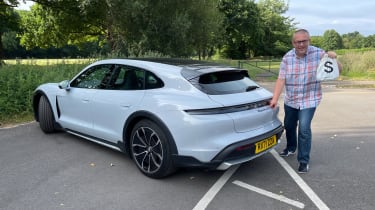 Porsche Taycan 4S Cross Turismo - John McIlroy holding a moneybag