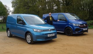 Auto Express senior test editor Dean Gibson standing between the Volkswagen Transporter and Volkswagen Caddy