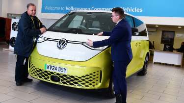 Auto Express editor-in-chief Steve Fowler leaning on the Volkswagen ID. Buzz with Volkswagen sales executive Tom Lodge 